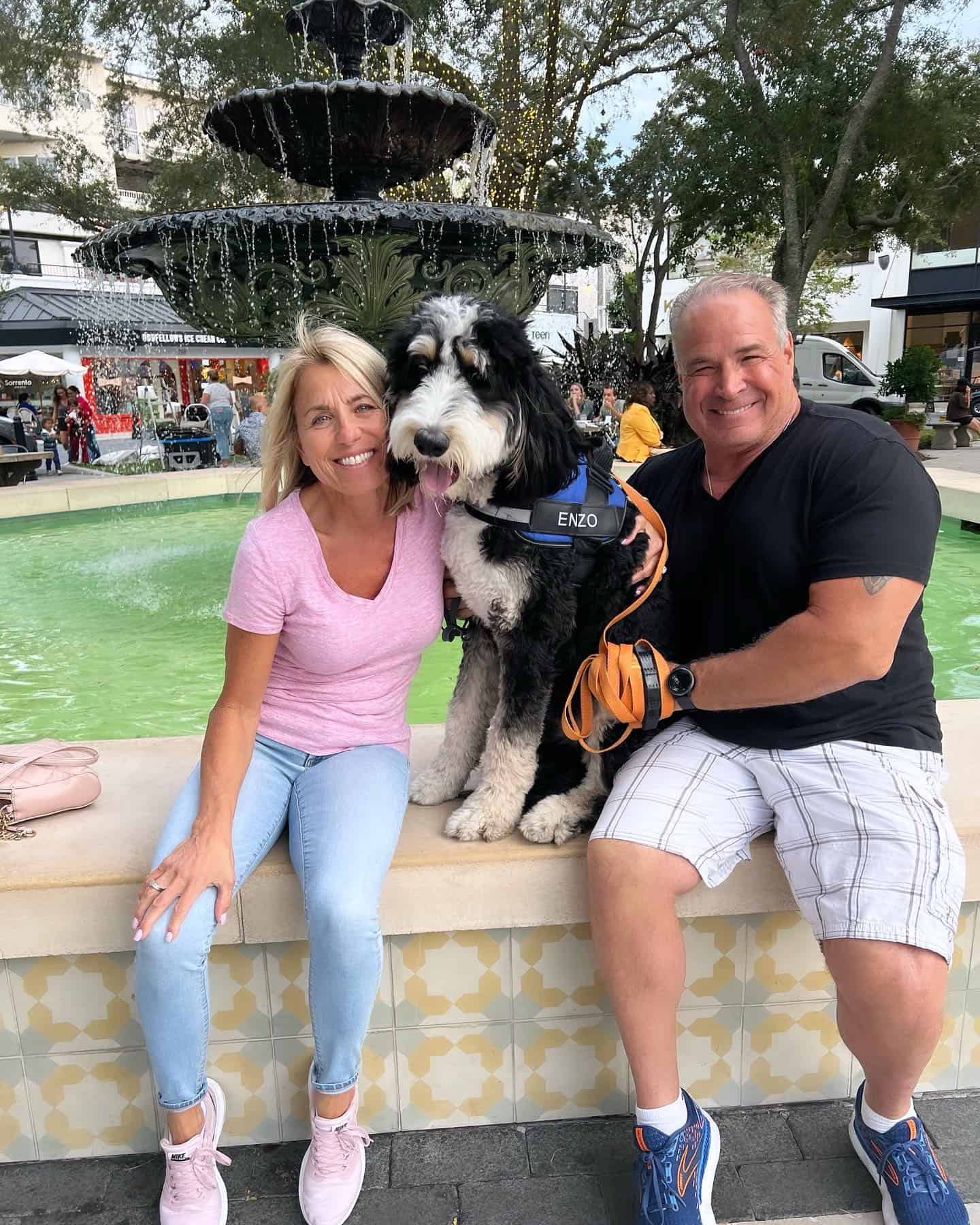 A happy couple with their dog after purchasing dog training in Denver, CO